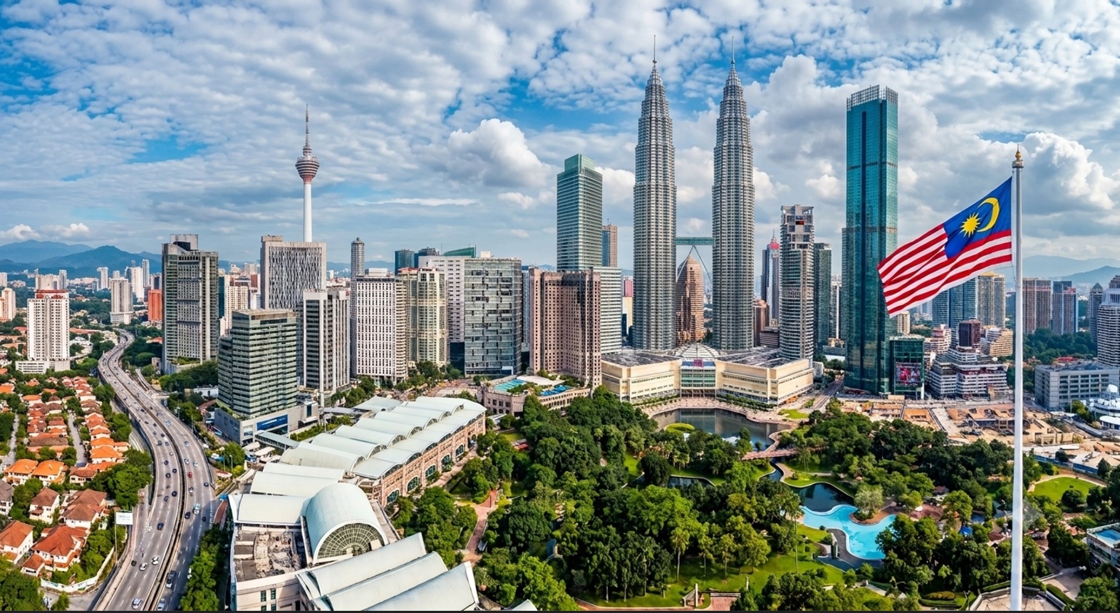 Kuala Lumpur skyline with the Malaysian flag at sunset